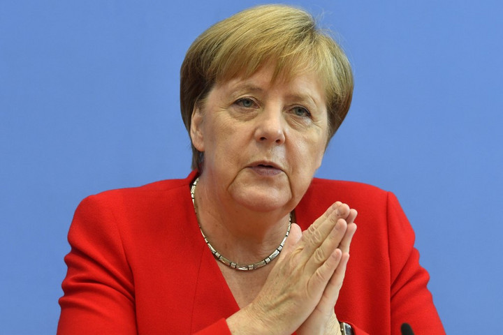 Fotó: AFP/John MacDougall Merkel szerint nagy lépést tettek előre Irán ügyében